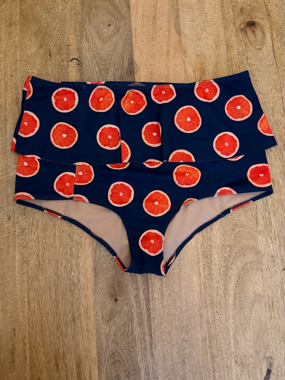 Kortni Jeane Navy Bikini Bottoms with Red-Orange Citrus Print